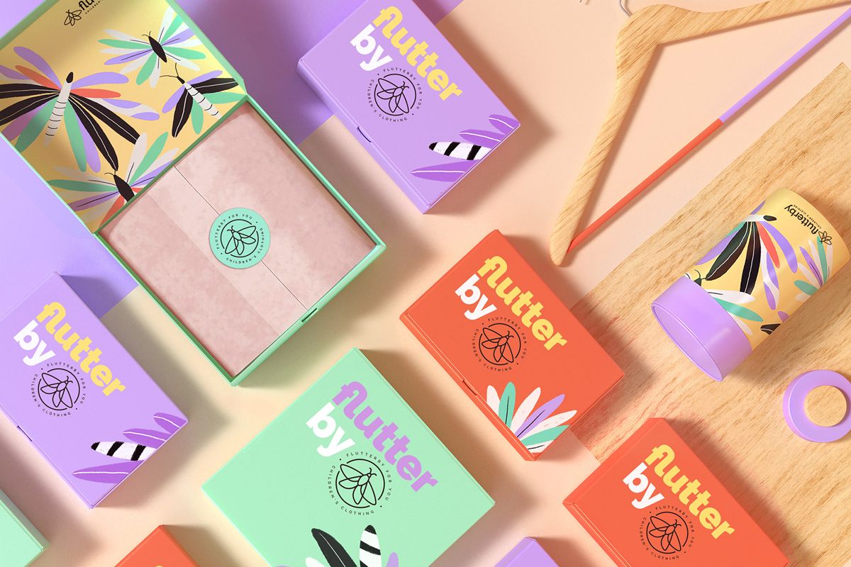 Top view of various packaging boxes with a clothing packaging design applied.