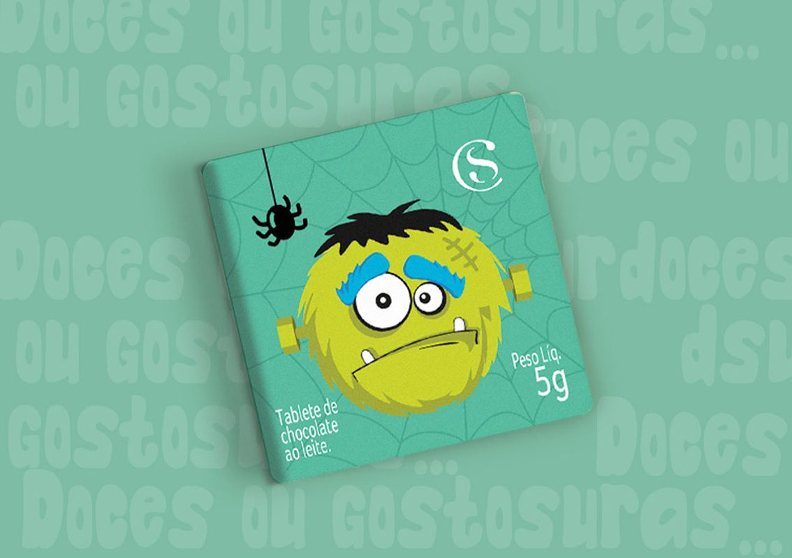 Green Halloween candy packaging with cobweb in  the background and Frankenstein's monster in the front.